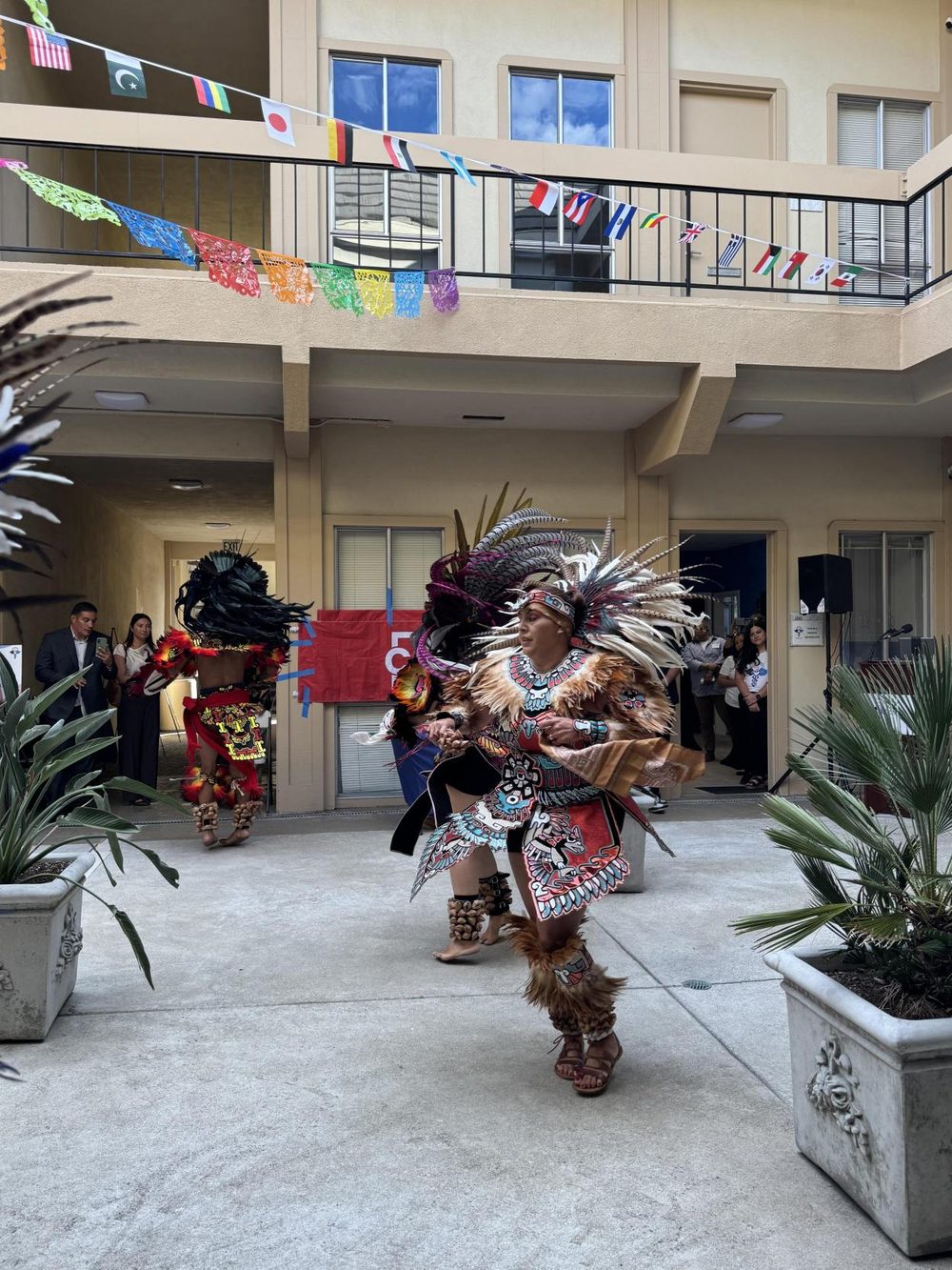 Danza Azteca dancers performing in feathered regalia