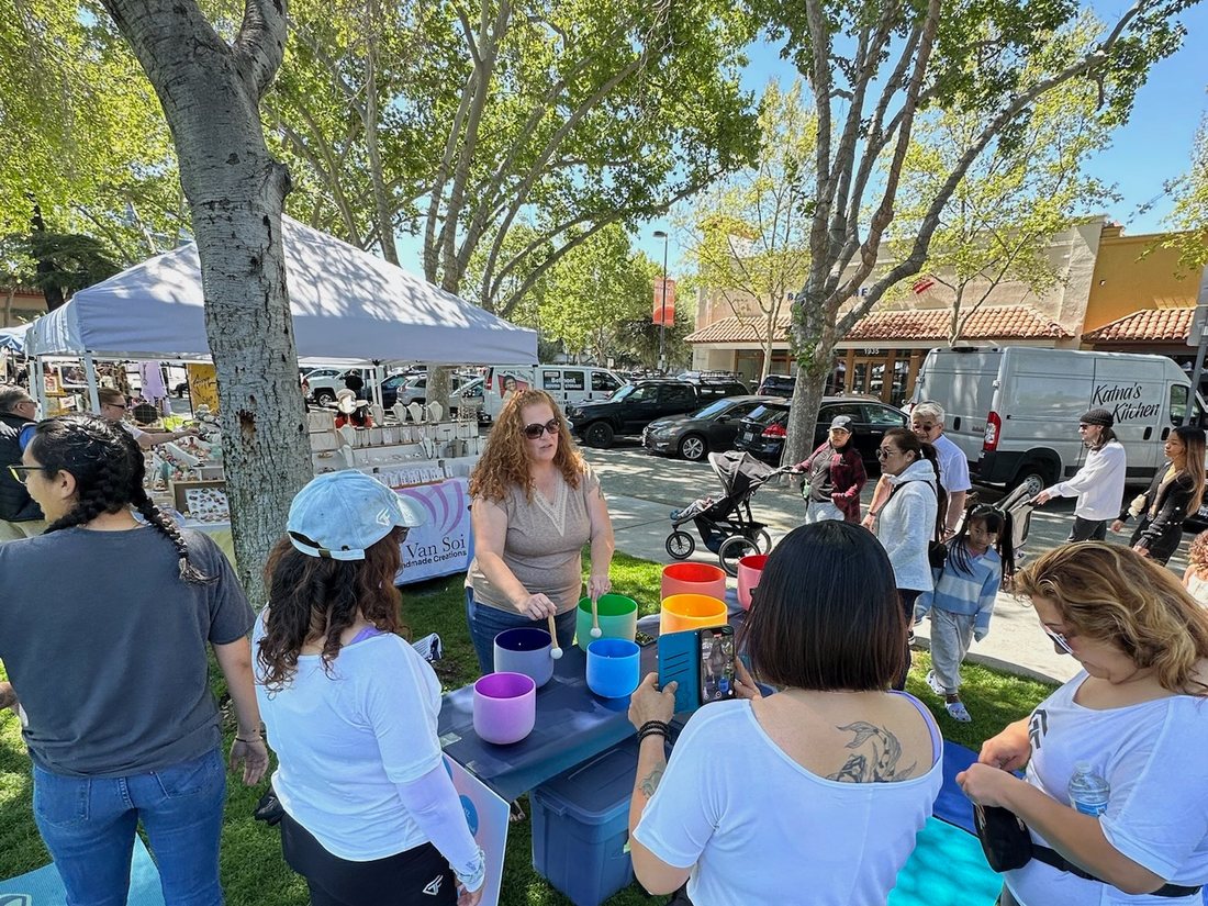 Community members at an outdoor wellness gathering
