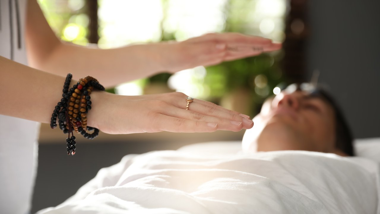 Hands offering reiki energy healing